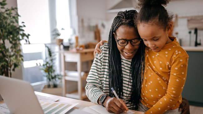 working mom at home with her daughter