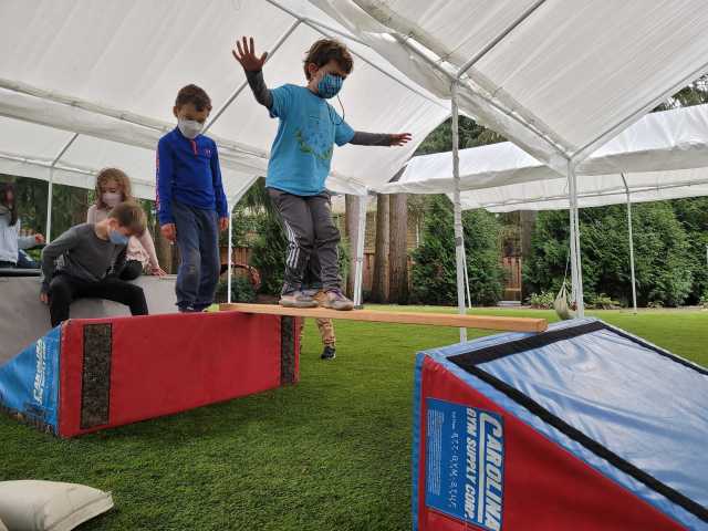 kids jump from one cushion to the next at a mid-winter break camp seattle with Kong Academy