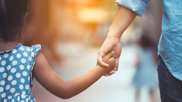 two kids holding hands