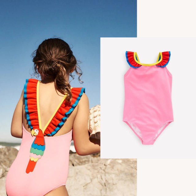 child carrying seashell wearing the parrot swimsuit
