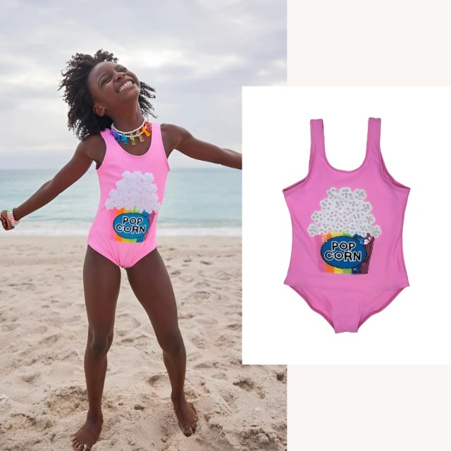 child wearing the swimsuit on the beach