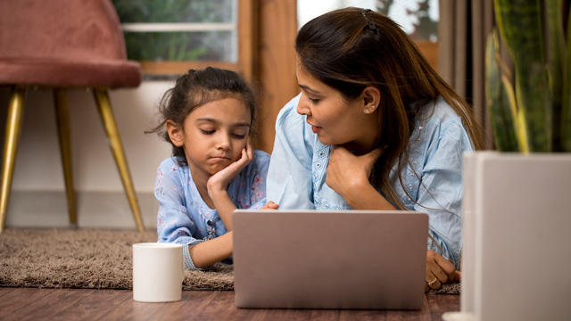 mother talking to her daughter, who is sad