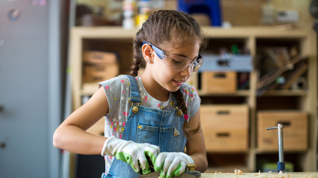 little girl in shop class