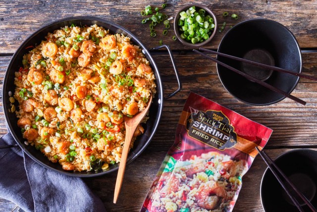 a bag of Trader Joe's stir fried rice with shrimp with some in a bowl
