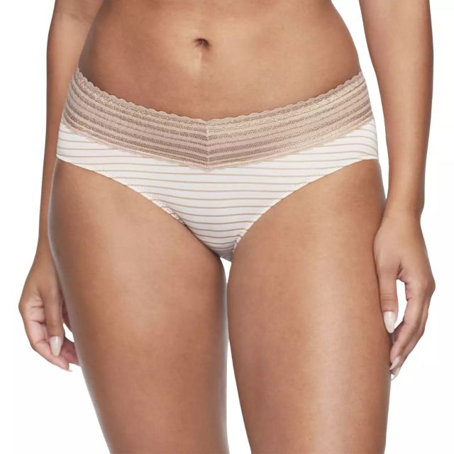 bottom half of woman standing wearing white and tan striped underwear