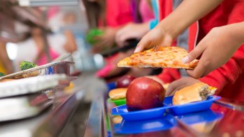 kid getting lunch from the school cafeteria