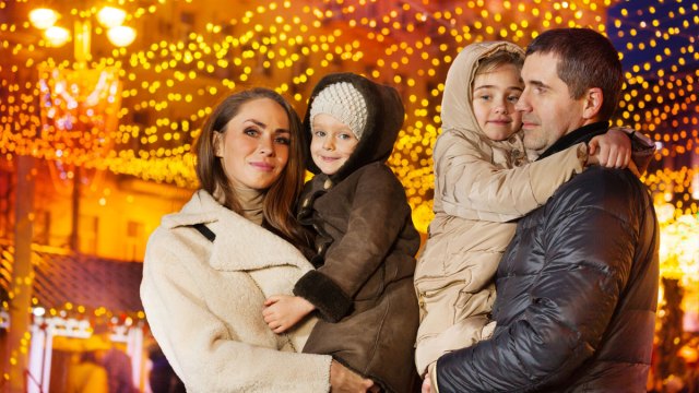 family smiling for a holiday photo
