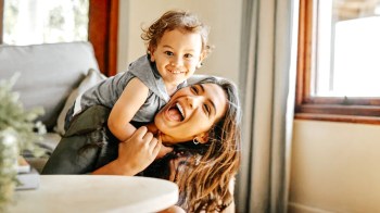 a mom who is living the best mom advice she's ever received playing with her toddler