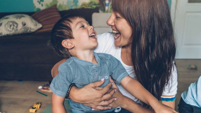son practicing speech sounds and talking and laughing with his mom