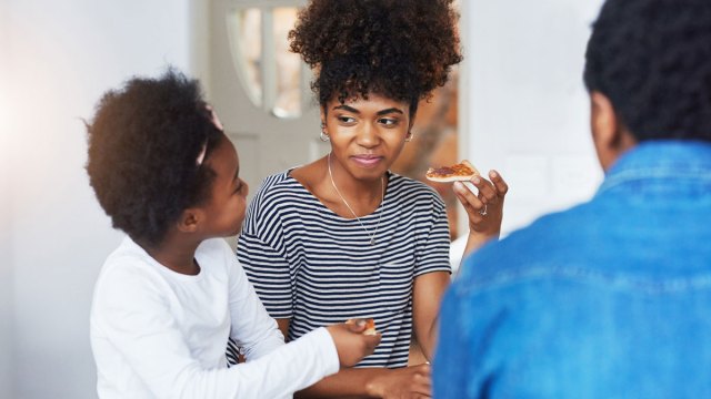 girl talking to her mother at the dinner table