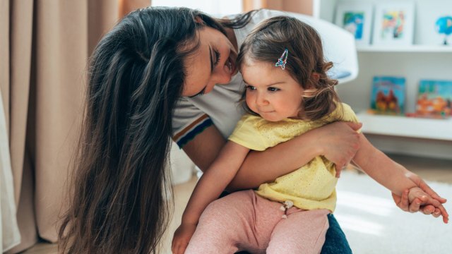 mom comforting toddler to prevent a tantrum