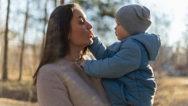 mom using the whisper technique on her toddler