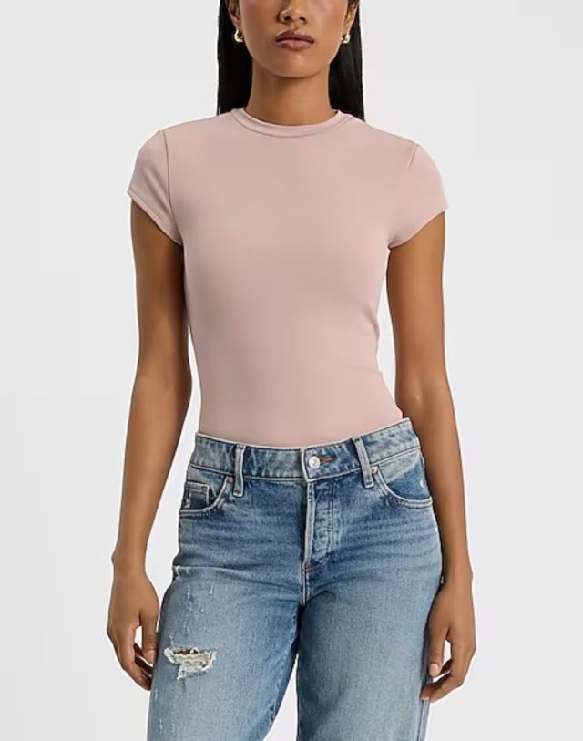 woman wearing jeans and short sleeve taupe compression t-shirt