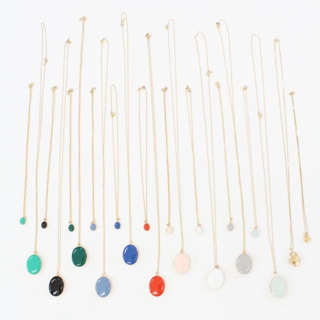 collection of different colored enamel locket necklaces