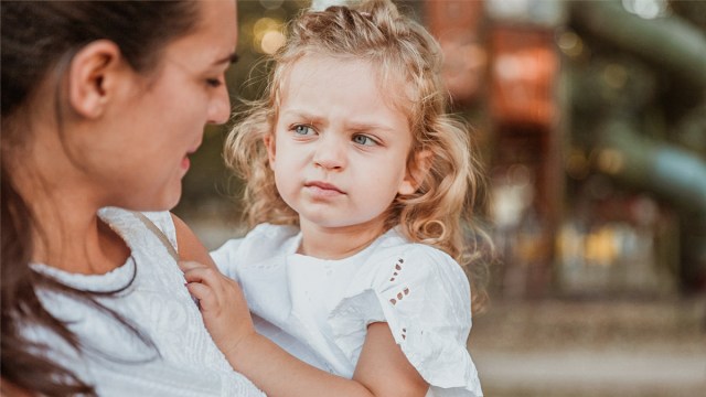 little girl giving mom the stink eye