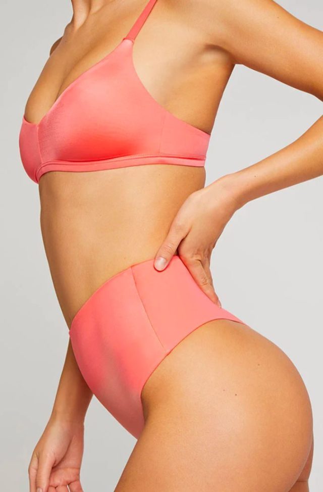 woman in coral colored bra and underwear