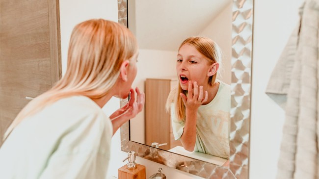 a picture of a girl using viral skincare products