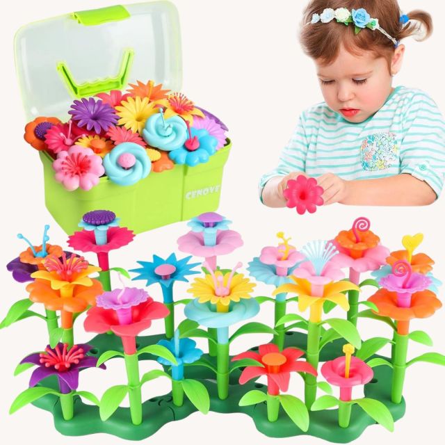 toddler girl playing with a toy set of colorful plastic flowers designed to stack together