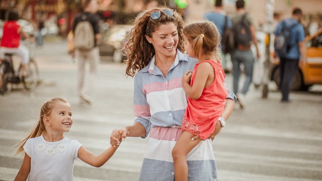 mother walking with two daughters on a weekend