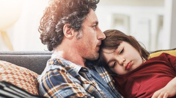 a dad consoling his daughter who has been through a trauma