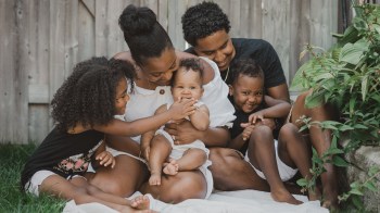 a professional photo of a family dressed in black and white, one of the best family photo outfit ideas