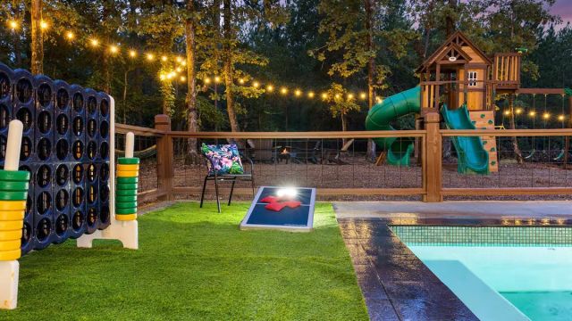 backyard with yard games and pool