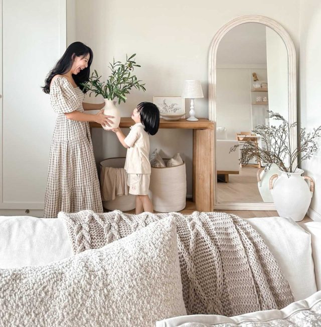 a parent and child in a modern farmhouse living room
