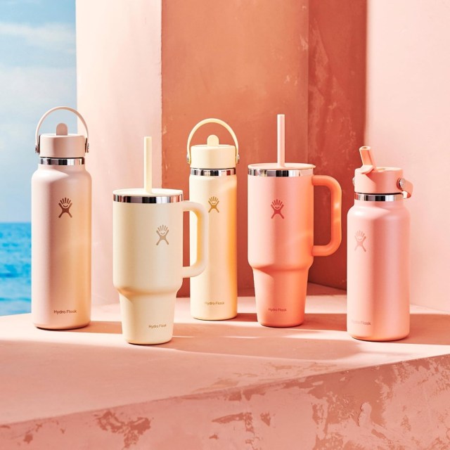 collection of hydro flask tumblers and bottles