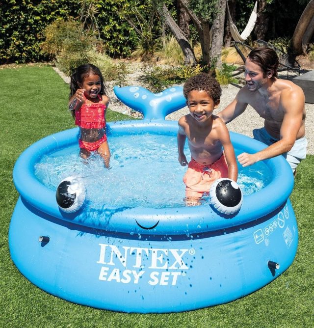 children playing outside in an inflatable pool