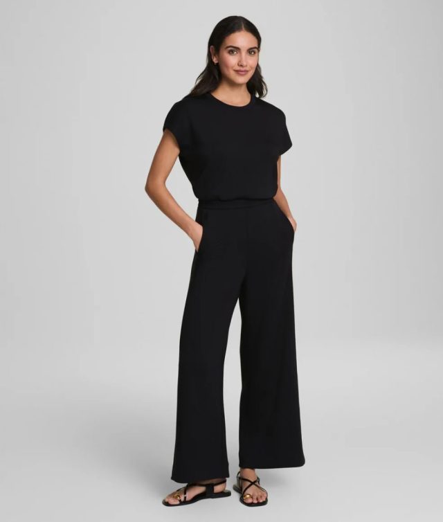 person wearing the black jumpsuit