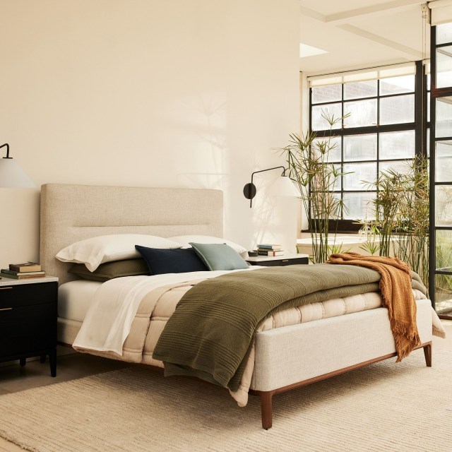 a modern bedroom decorated in west elm items