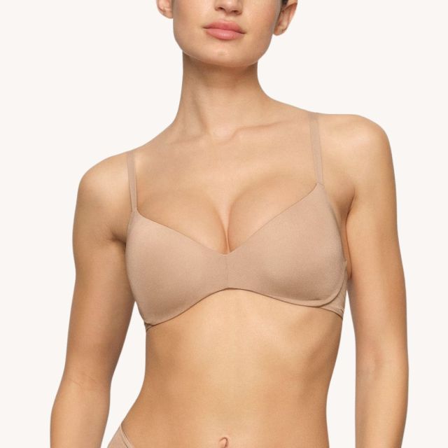 woman wearing nude colored wireless push up bra