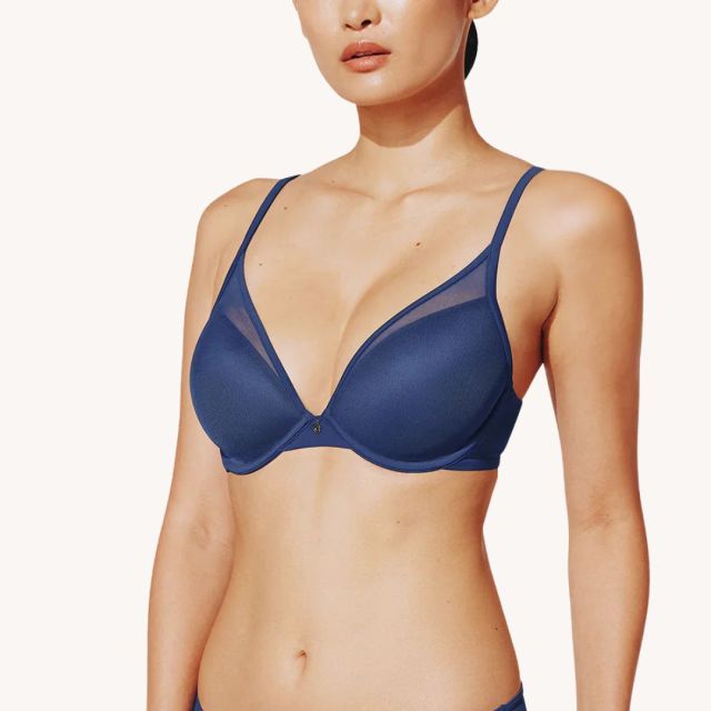 woman wearing navy blue push up bra with mesh detail
