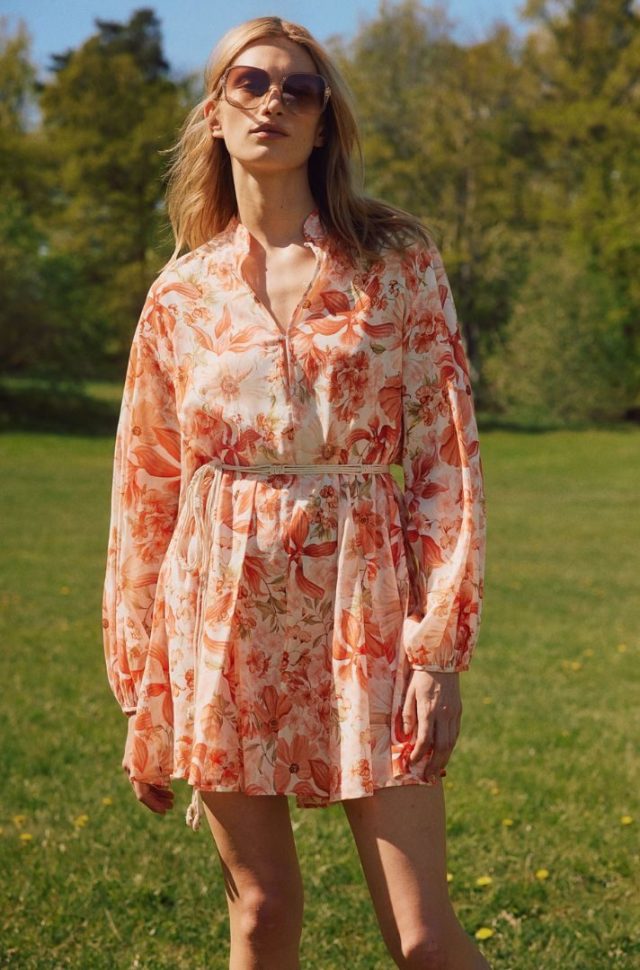 woman wearing red floral dress