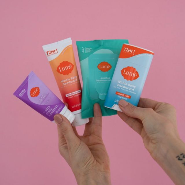 hands holding 4 Lume products