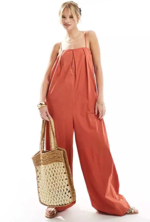 woman wearing orange loose-fitting jumpsuit