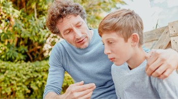 father talking to son after he made a rude comment