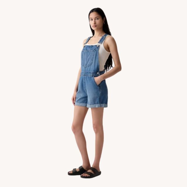 woman wearing denim short overalls