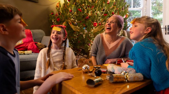a family playing Christmas Minute to Win It Games
