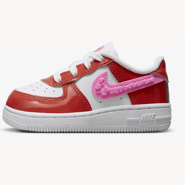 pink and red toddler Nike sneakers