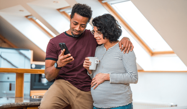 parents at their nesting party discussing digital nesting and their plans for protecting their baby's digital footprint