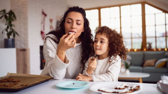 a mom and daughter eating cooking because the mom knows never to make a decision on an empty stomach
