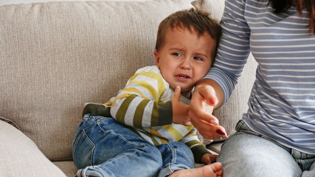 a mother sitting with a toddler after a tantrum saying nothing, one of the best tips for how to handle a toddler tantrum