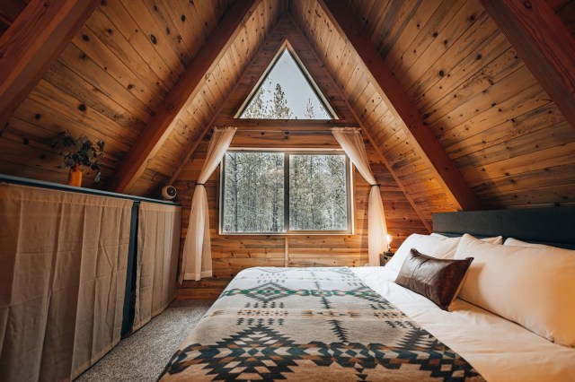 rustic bedroom in a-frame cabin