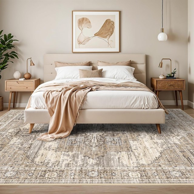 a neutral bedroom with vintage area rug