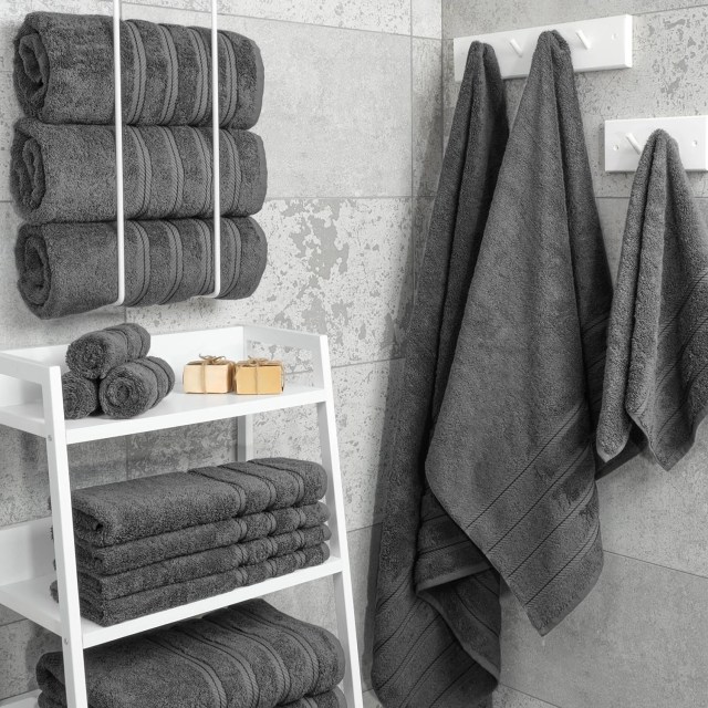 grey towels hanging in bathroom