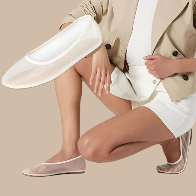 person wearing white sheer ballet flats