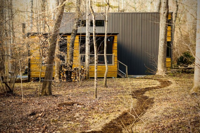 a modern cabin in the woods