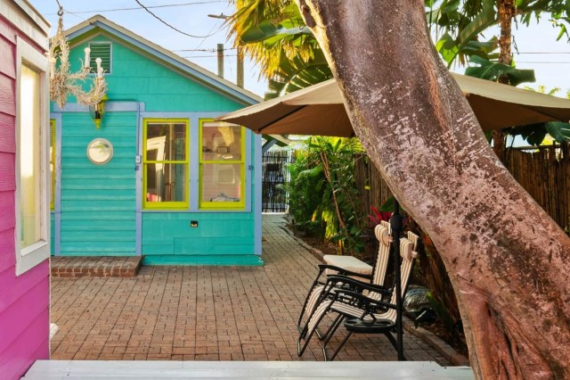 a bright blue beach bungalow