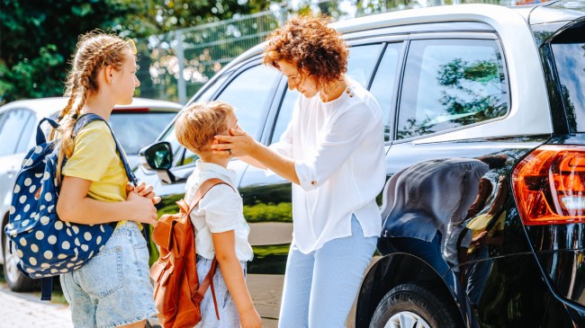 A mom dropping her kids at school knowing they can be in contact on their Spacetalk watches